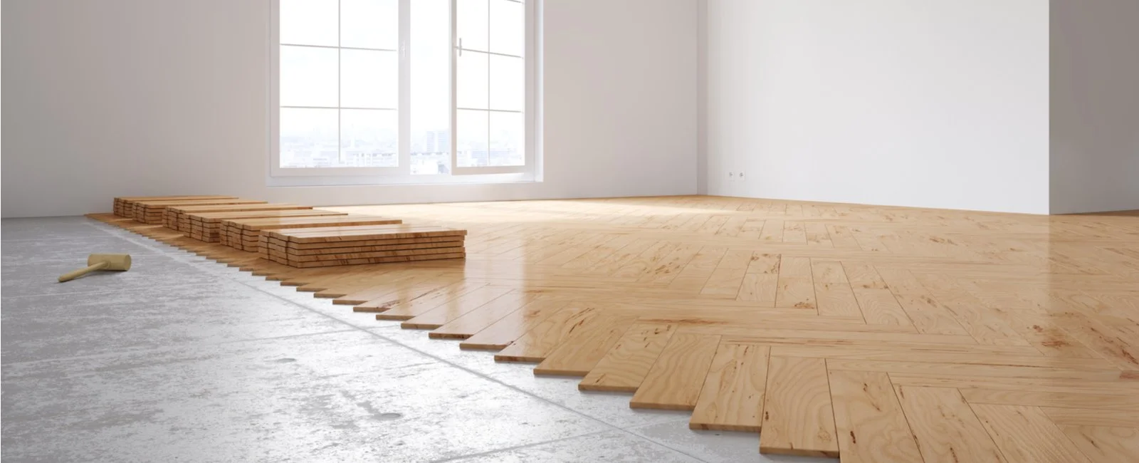 Pose de parquet en cours dans une pièce en rénovation